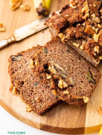sliced almond flour banana bread on a wood cutting board
