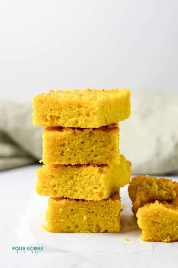 Four pieces of keto cornbread stacked.