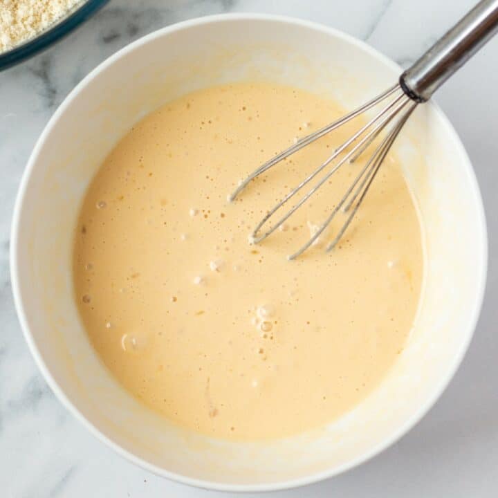Bowl with wet scone ingredients that were mixed with a whisk.