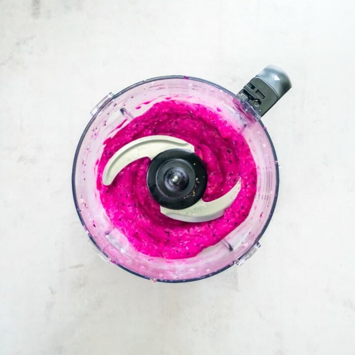 Blender containing blended dragon fruit smoothie