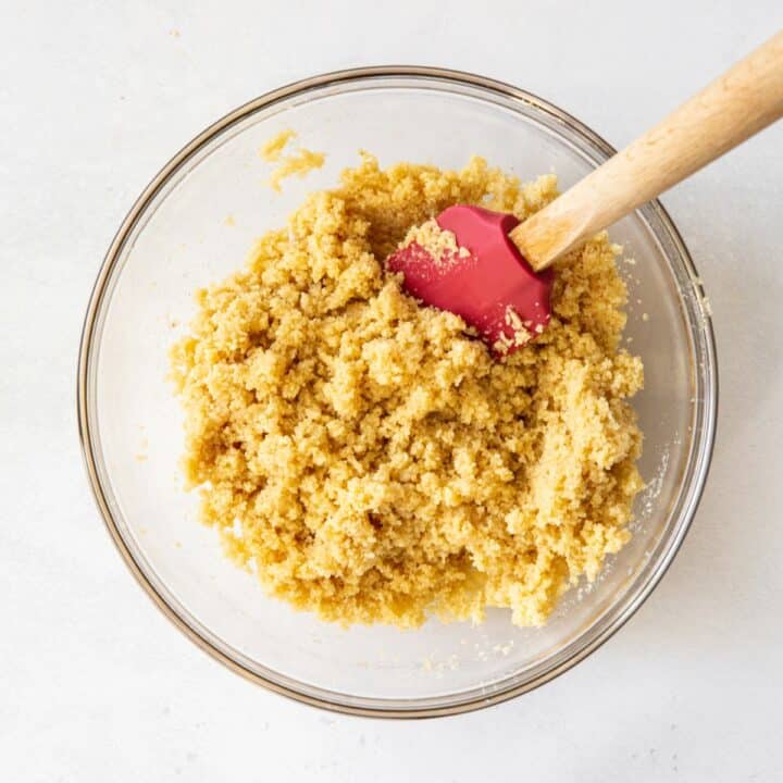 Glass bowl with crumbly cheesecake crust.