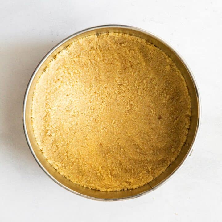 Springform pan with the crust pressed into the bottom and slightly up the sides.