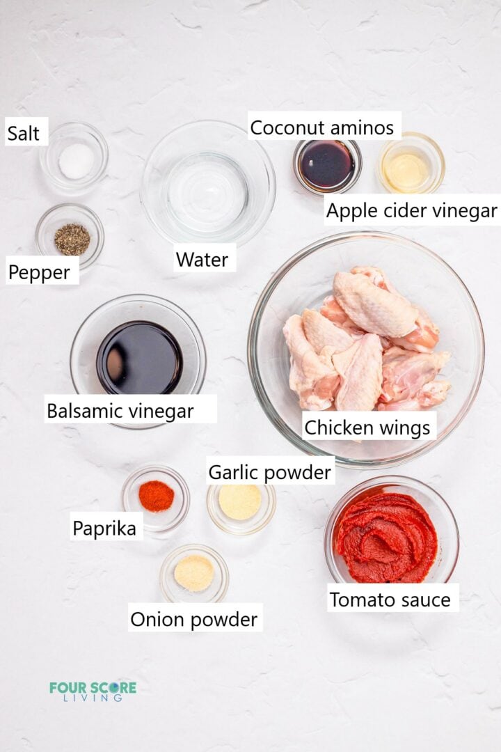 Individual glass bowls containing the ingredients to make keto chicken wings.