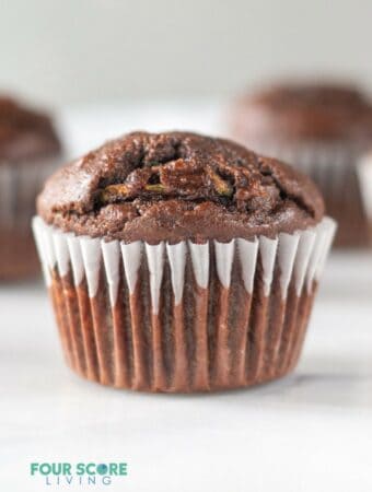 a chocolate muffin in a cupcake liner.