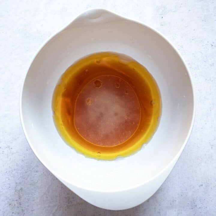 Bowl containing the salad dressing ingredients.