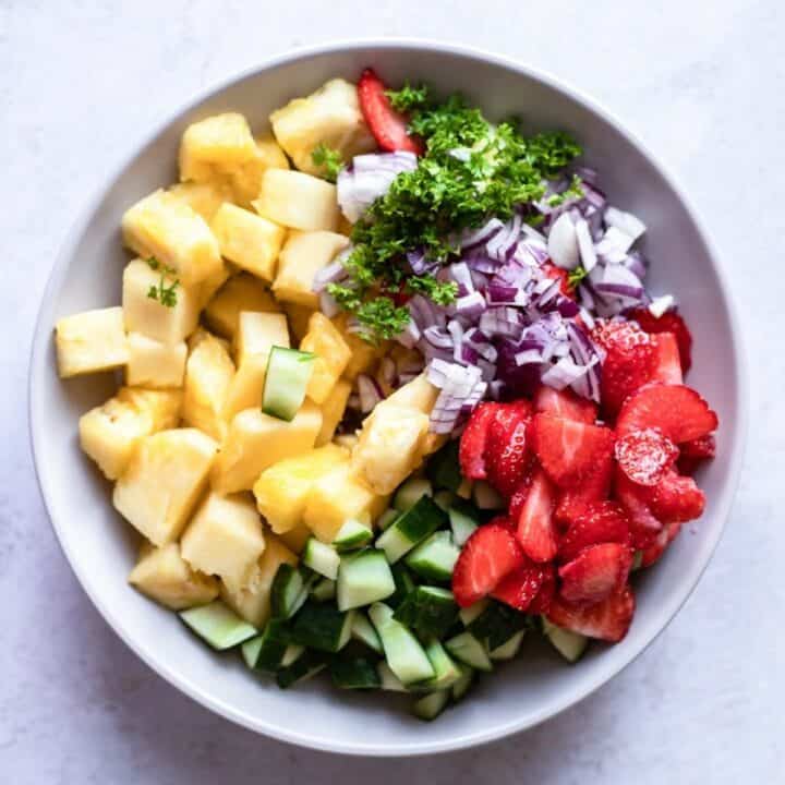 Bowl containing the pineapple salad ingredients, not yet mixed together.