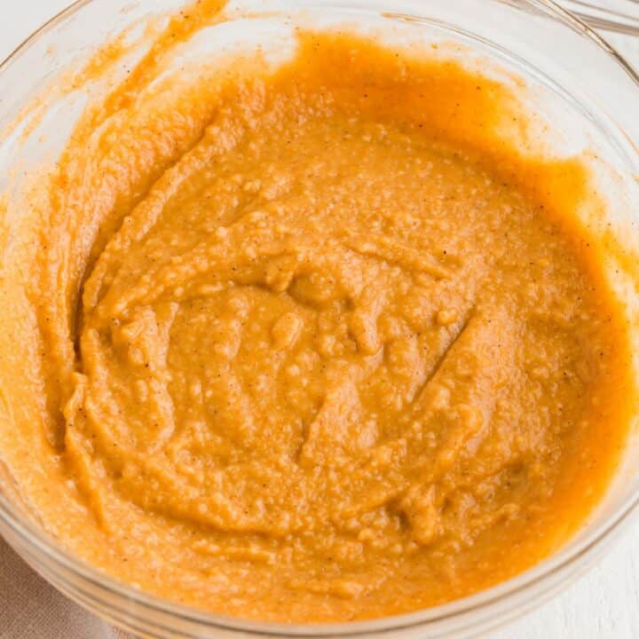 Glass bowl with keto pumpkin bread batter.