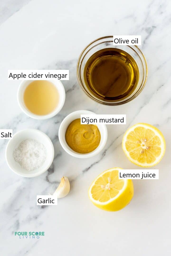 Ingredients for making sugar free salad dressing in separate bowls.