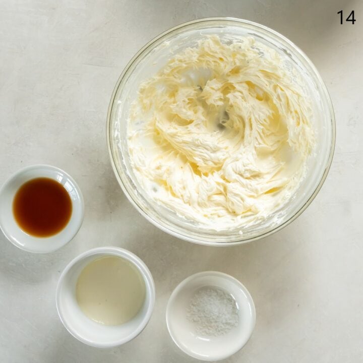A glass bowl with the cream cheese, butter and sweetener mixed together. The vanilla, cream and salt are in individual bowls next to it.